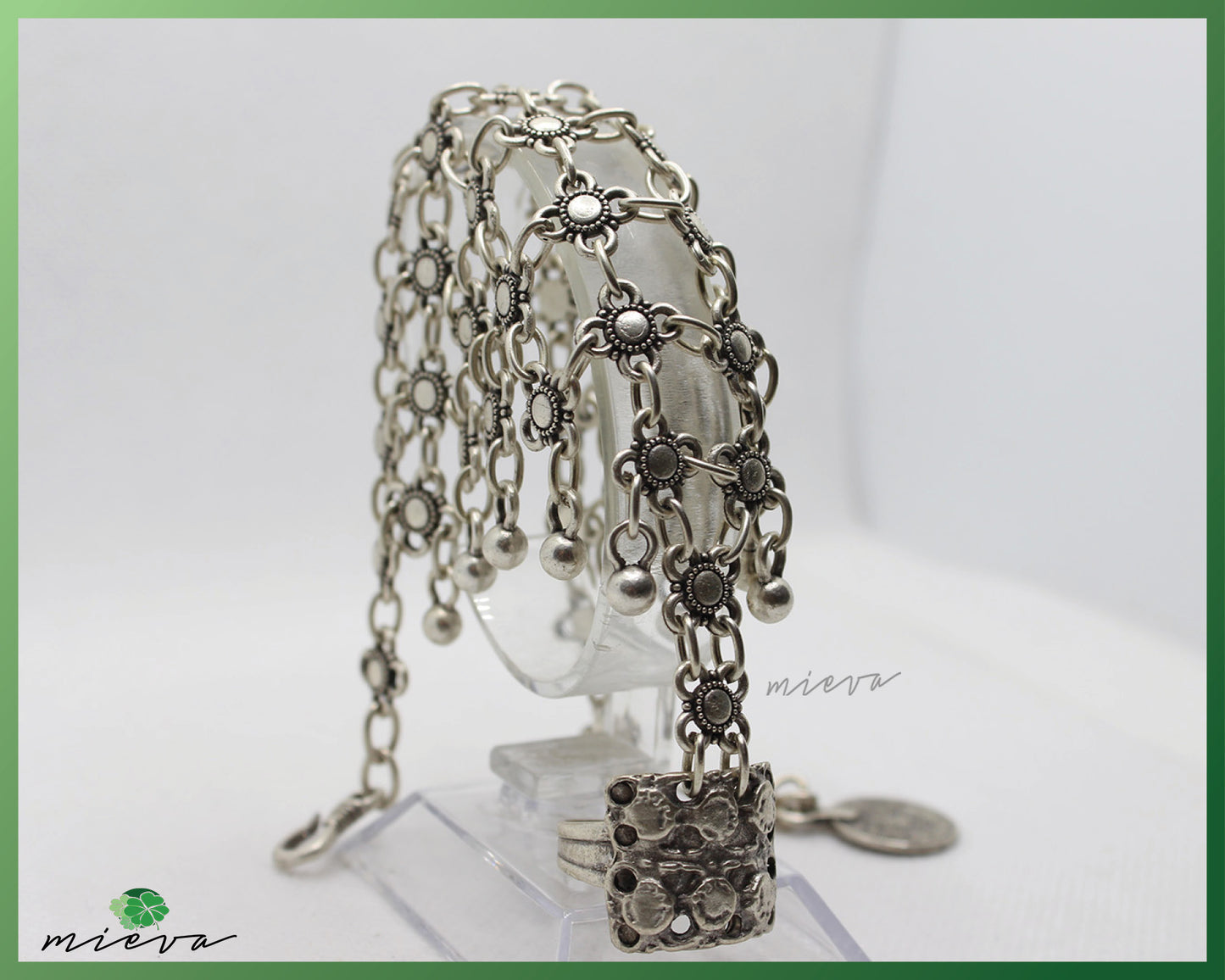 Bohemian Silver Charm Cascade Bracelet with Floral Accents