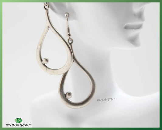 Sleek Silver Teardrop Earrings with Modern Twist Design