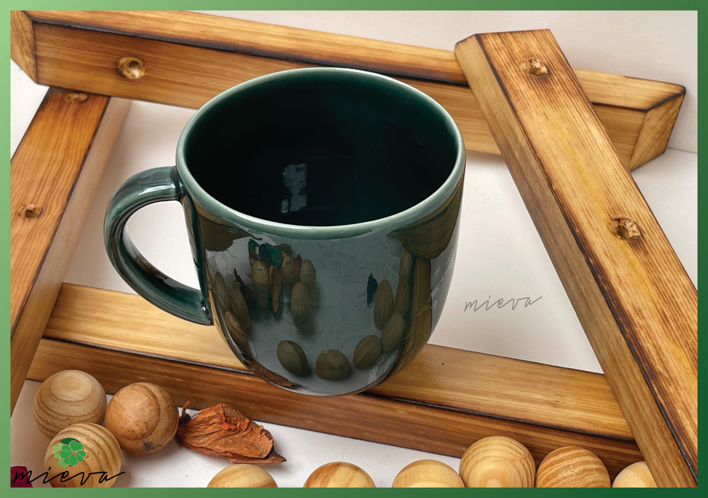 Reflective Green Ceramic Mug with Abstract Accents