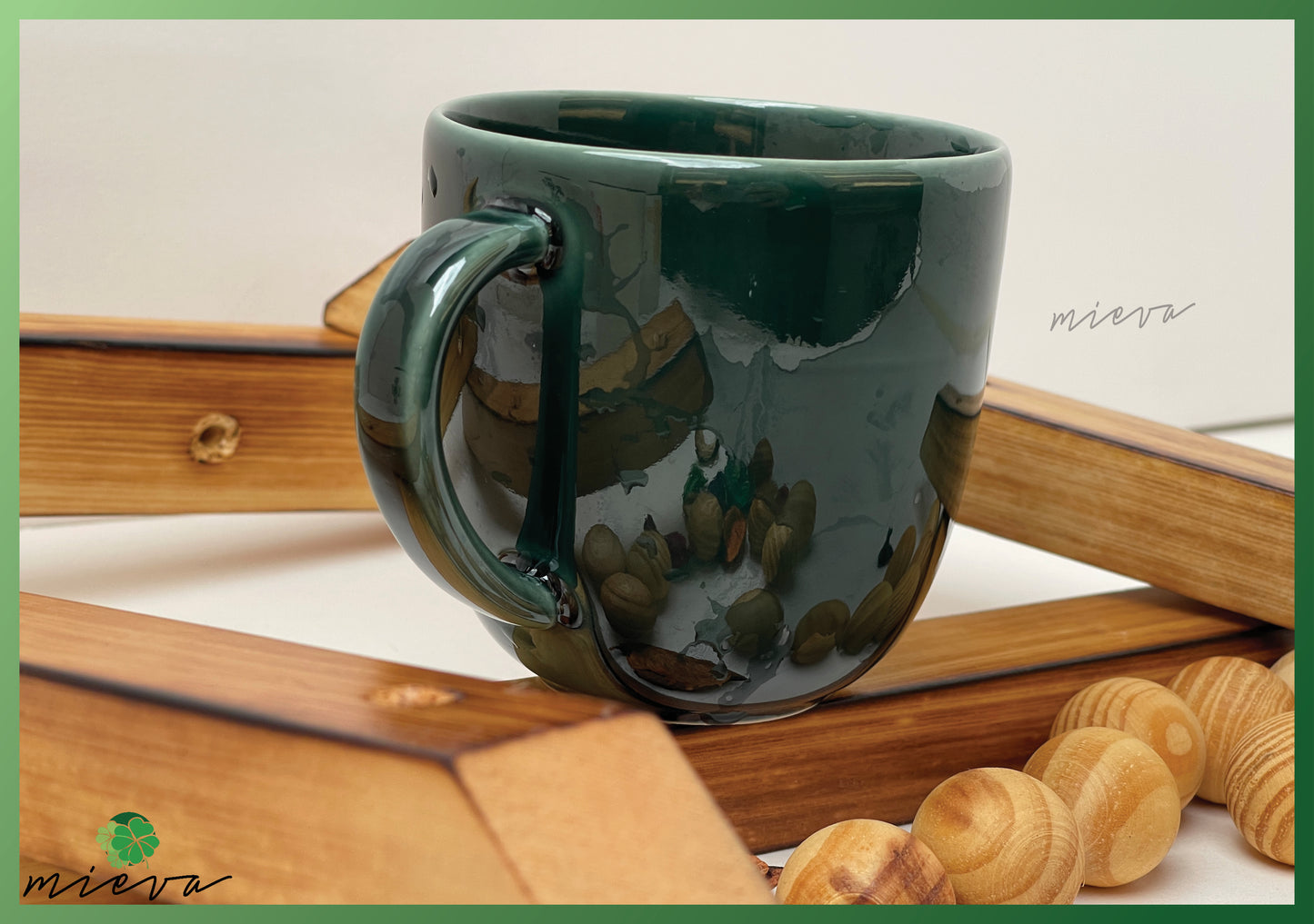 Reflective Green Ceramic Mug with Abstract Accents